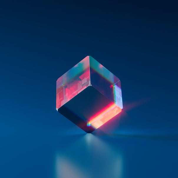 object resembling a shiny glass cube standing on one of its corners, blue background